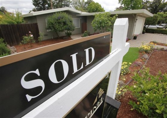 In this photo taken Monday, May 24, 2010, a sold home is shown in Palo Alto, Calif. Home prices fell in March from the previous month, signaling that temporary tax credits for buyers weren't enough to buoy the housing market.